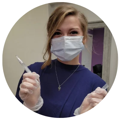 Image of Abby holding professional teeth whitening gel pen.